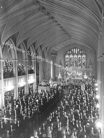 MISSION SCENE CANDLE -LIT SCENE INTERIOR FR.T.COUNIHAM S.J. PREACHING